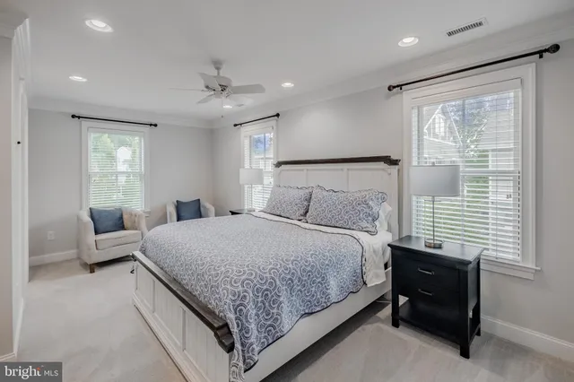 a bathroom with a tub a toilet a sink and shower