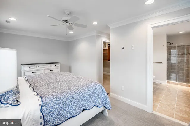 a bathroom with a granite countertop sink a toilet and a mirror
