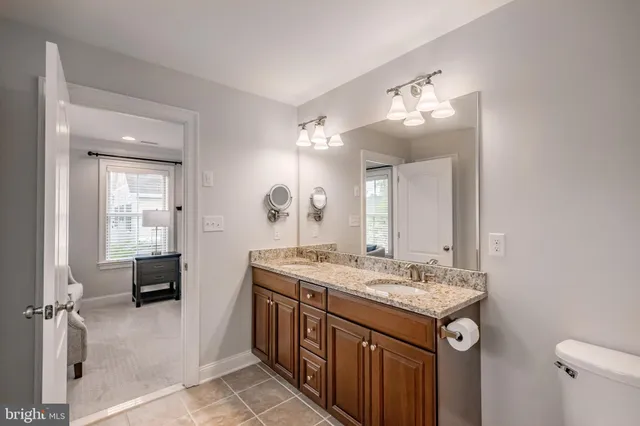 a bedroom with a bed and cabinets