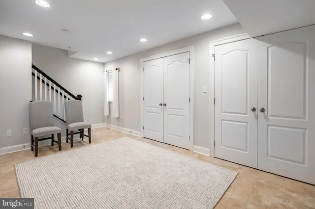 a view of a house with a yard and sitting area