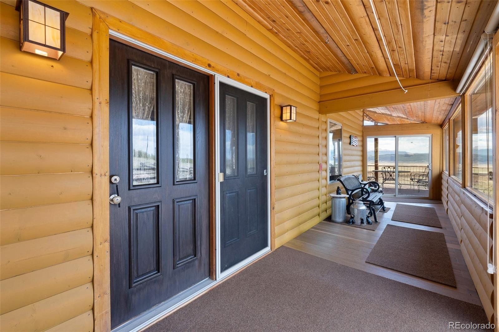 1163 Michigan Hill Road Jefferson, CO 80456 - Photo 18 of 48 a view of a porch with furniture