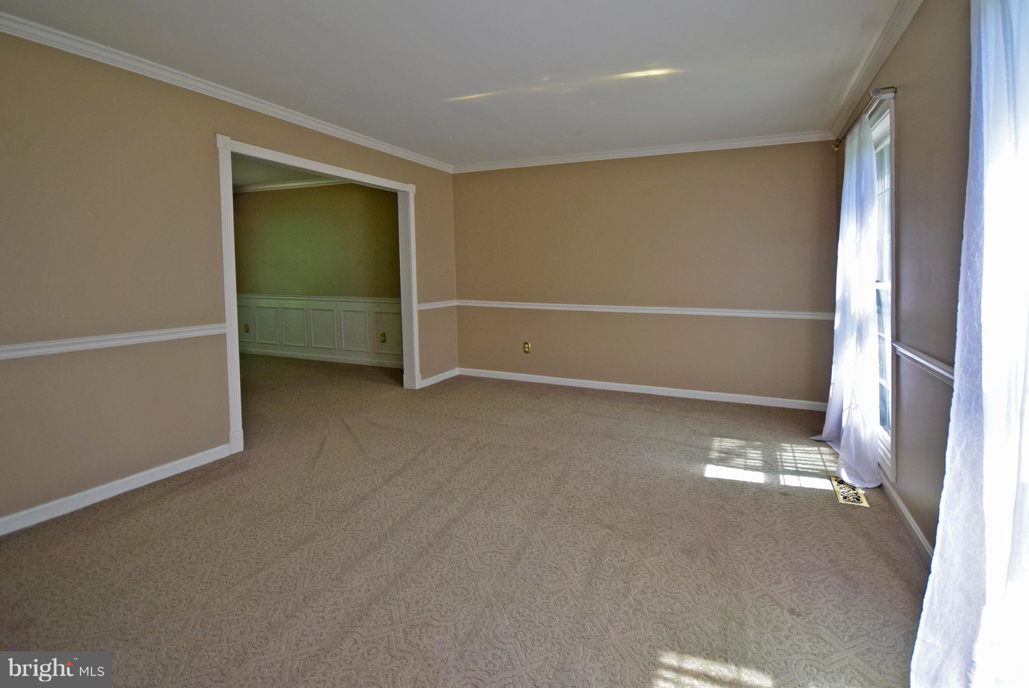 9 Charleston Court Stafford, VA 22554 - Photo 11 of 30 an empty room with a empty space and windows