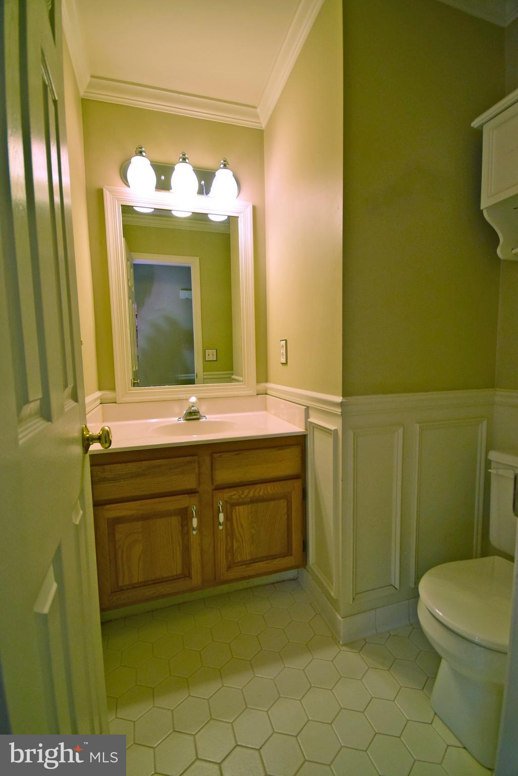 9 Charleston Court Stafford, VA 22554 - Photo 21 of 30 a bathroom with a sink a toilet and mirror