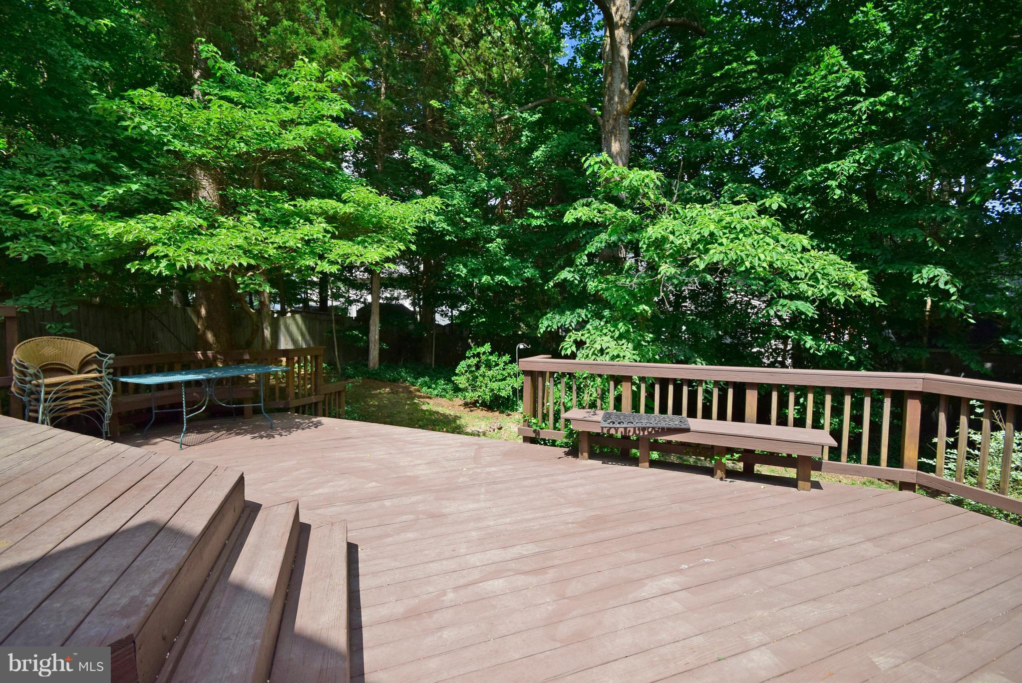 9 Charleston Court Stafford, VA 22554 - Photo 23 of 30 a view of a deck with chairs and wooden fence