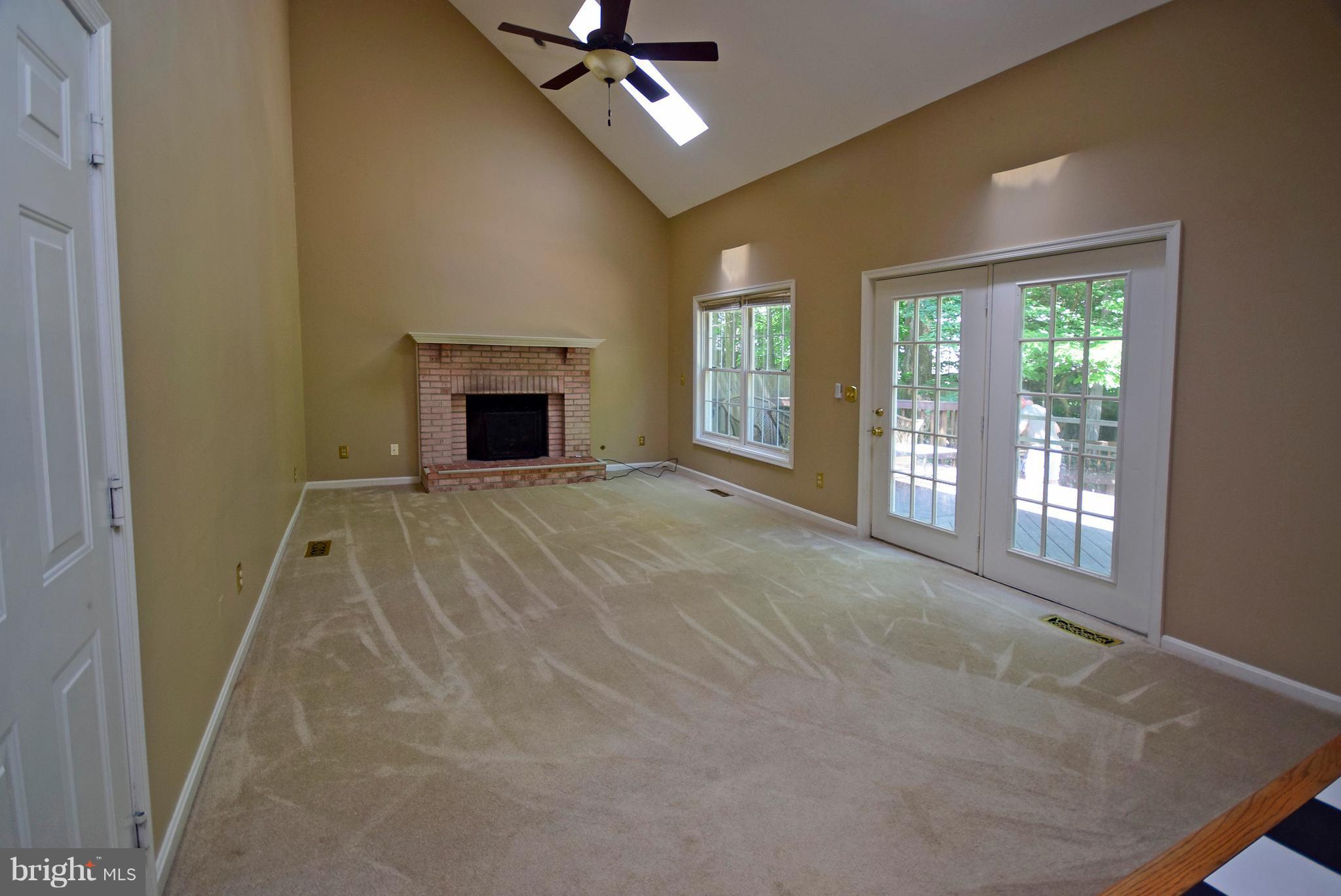 9 Charleston Court Stafford, VA 22554 - Photo 5 of 30 a view of an empty room with a fireplace and a window