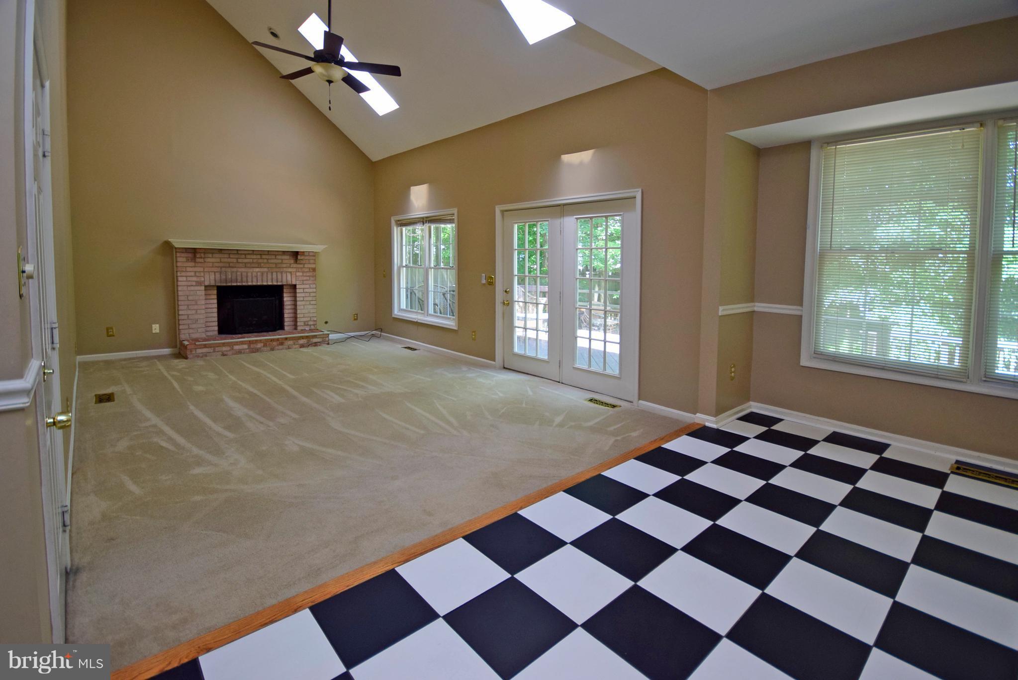 9 Charleston Court Stafford, VA 22554 - Photo 6 of 30 a view of a livingroom with a black and white checkered floor