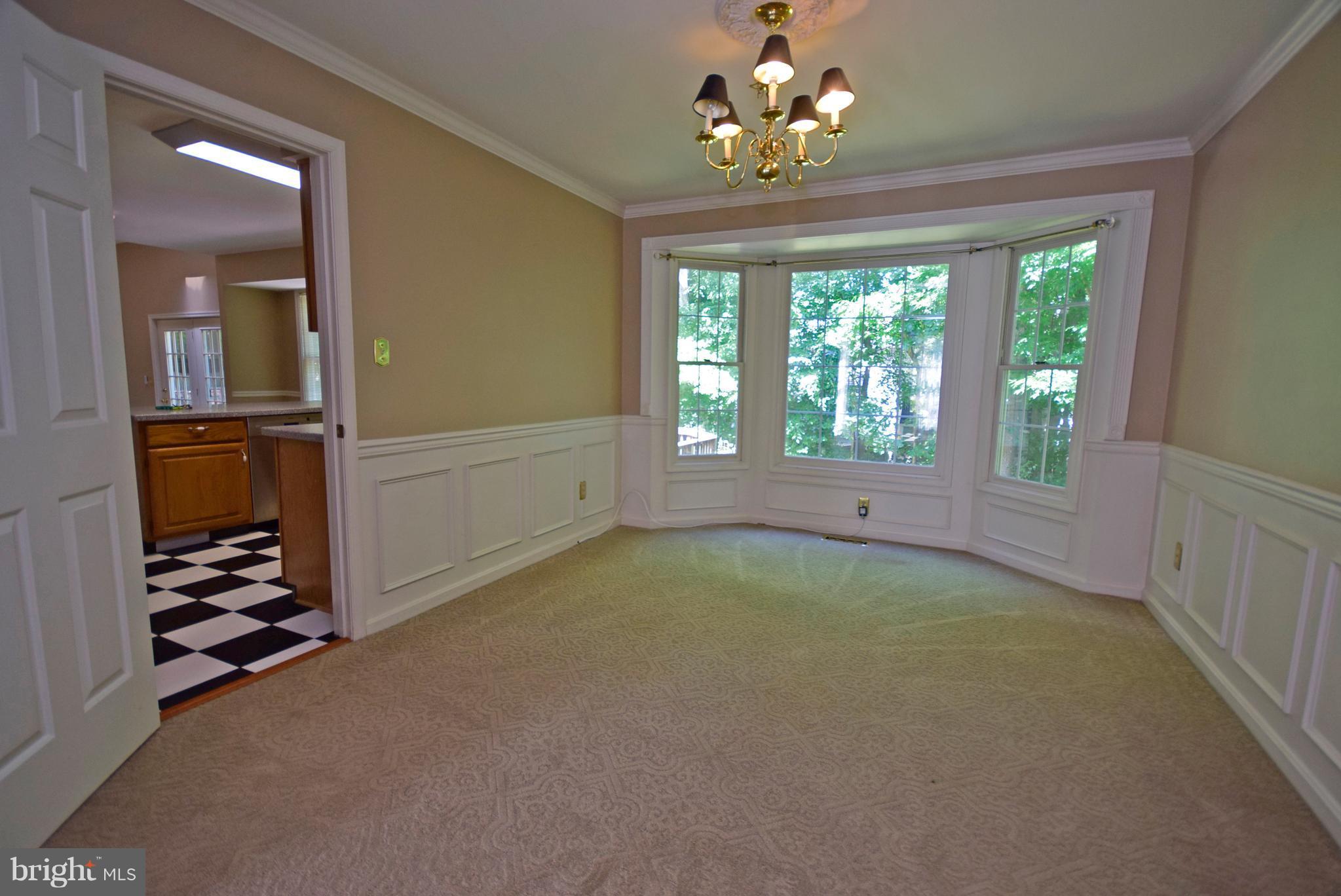 9 Charleston Court Stafford, VA 22554 - Photo 9 of 30 wooden floor in an empty room with a window