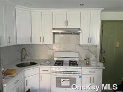 a kitchen with a stove and cabinets