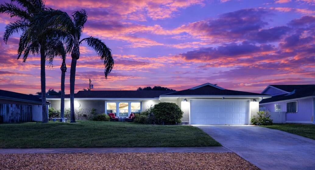 front view of a house with a yard