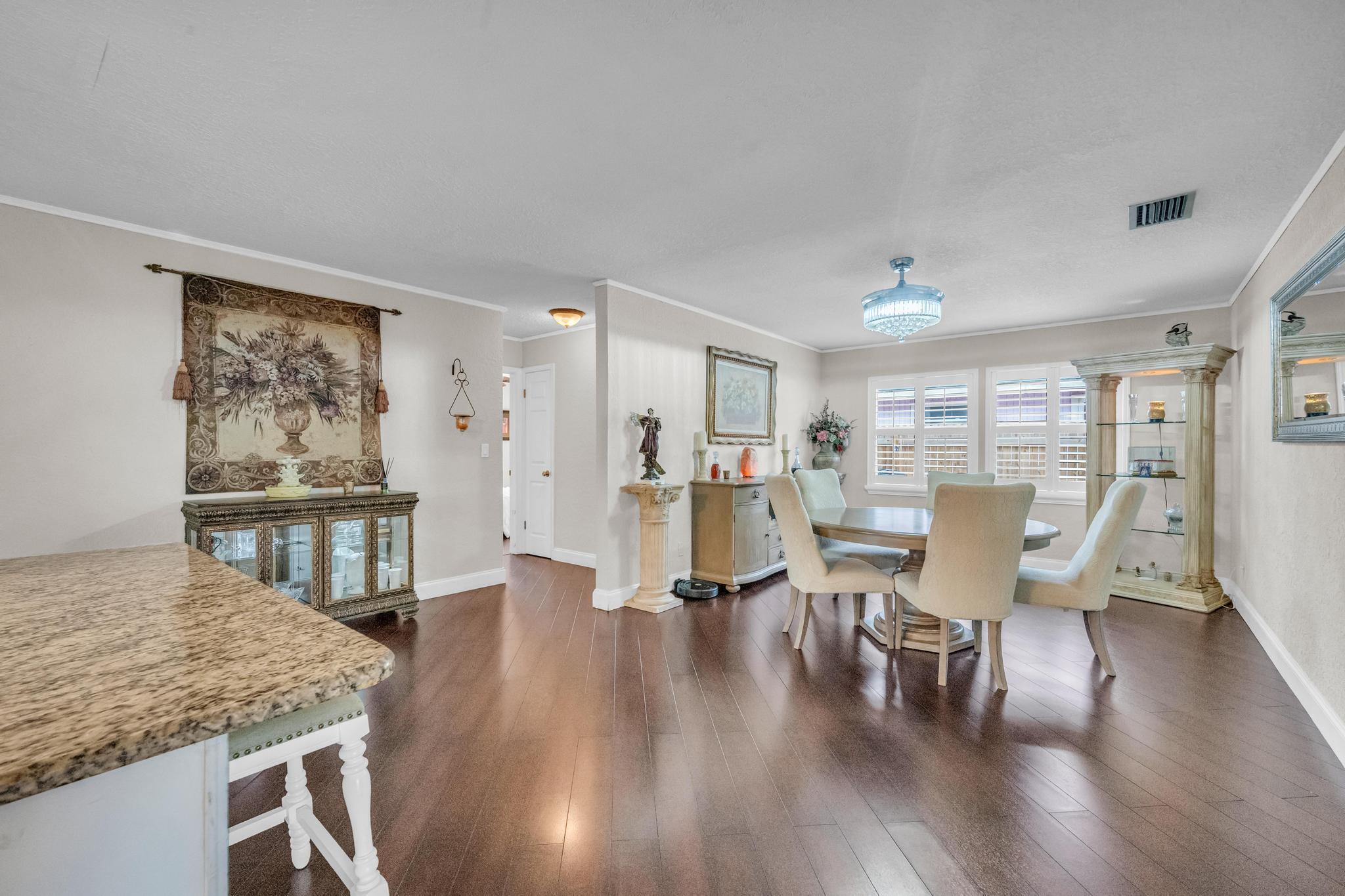 4167 Russell Street Jupiter, FL 33469 - Photo 21 of 60 a living room with furniture wooden floor and a large window