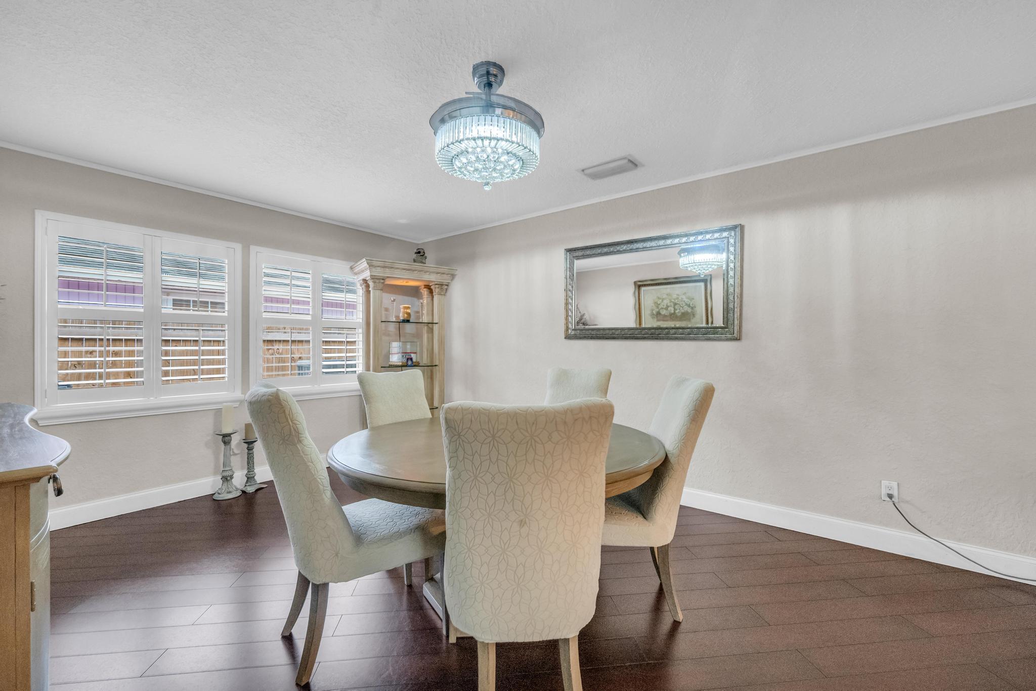 4167 Russell Street Jupiter, FL 33469 - Photo 22 of 60 a view of a dining room with furniture window and wooden floor