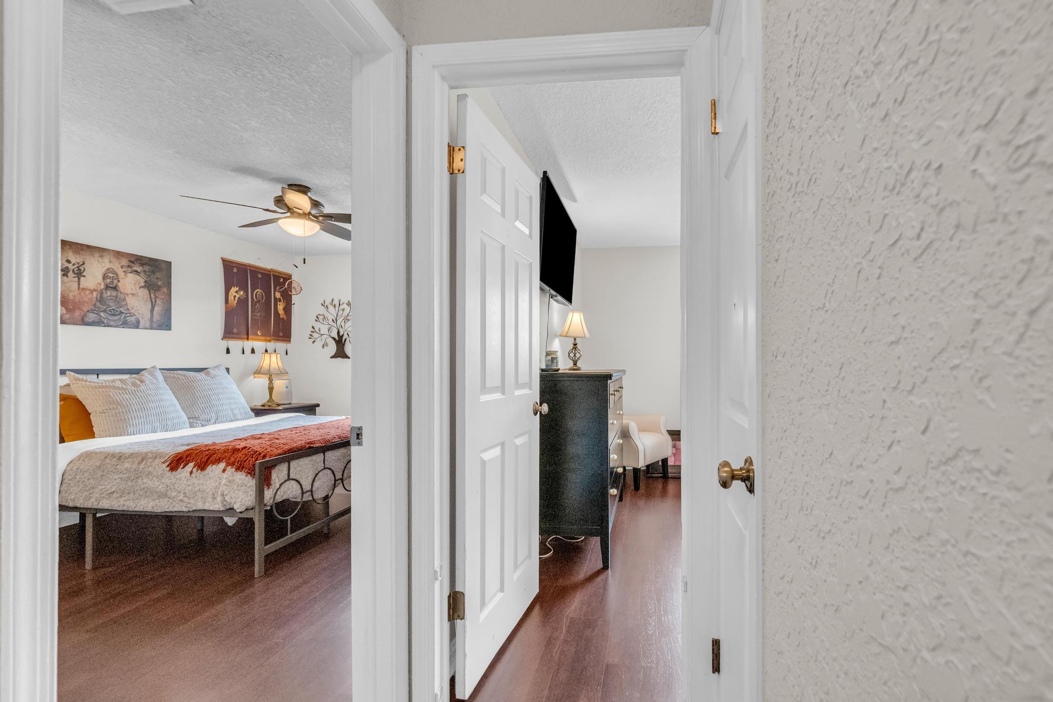 4167 Russell Street Jupiter, FL 33469 - Photo 25 of 60 a bedroom with a bed and a view of bathroom