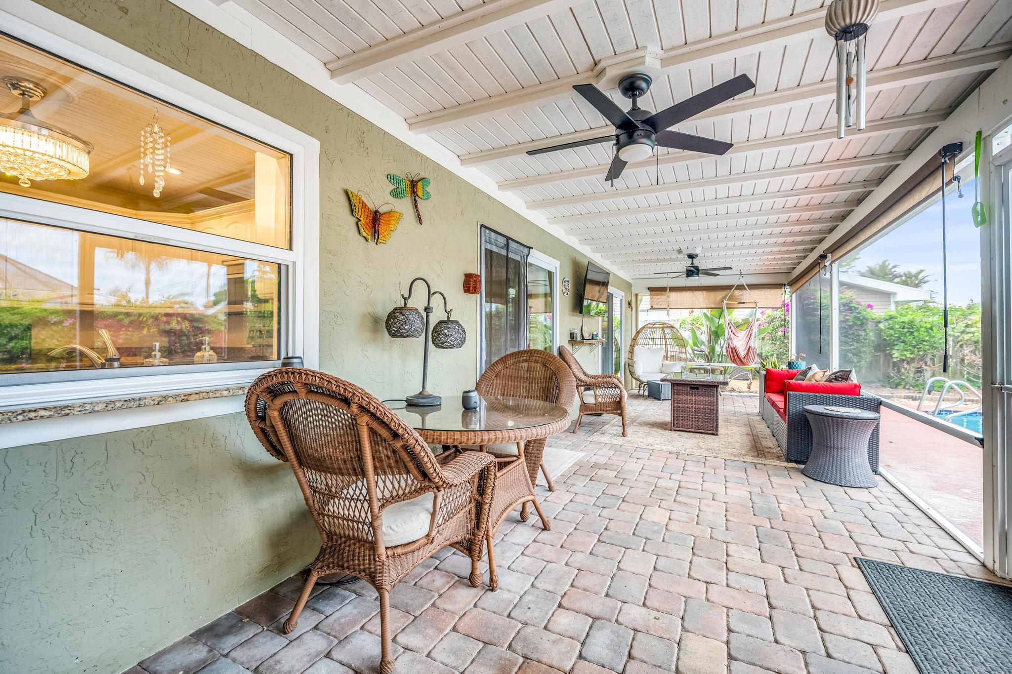 4167 Russell Street Jupiter, FL 33469 - Photo 35 of 60 a living room with patio furniture and a large window