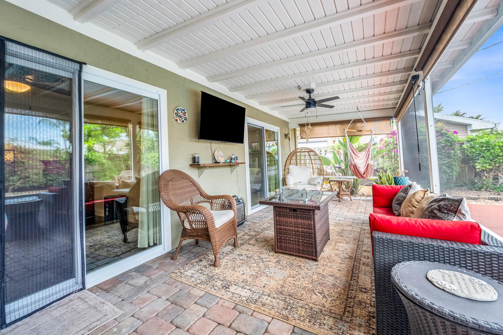 4167 Russell Street Jupiter, FL 33469 - Photo 36 of 60 a living room filled with furniture and a floor to ceiling window