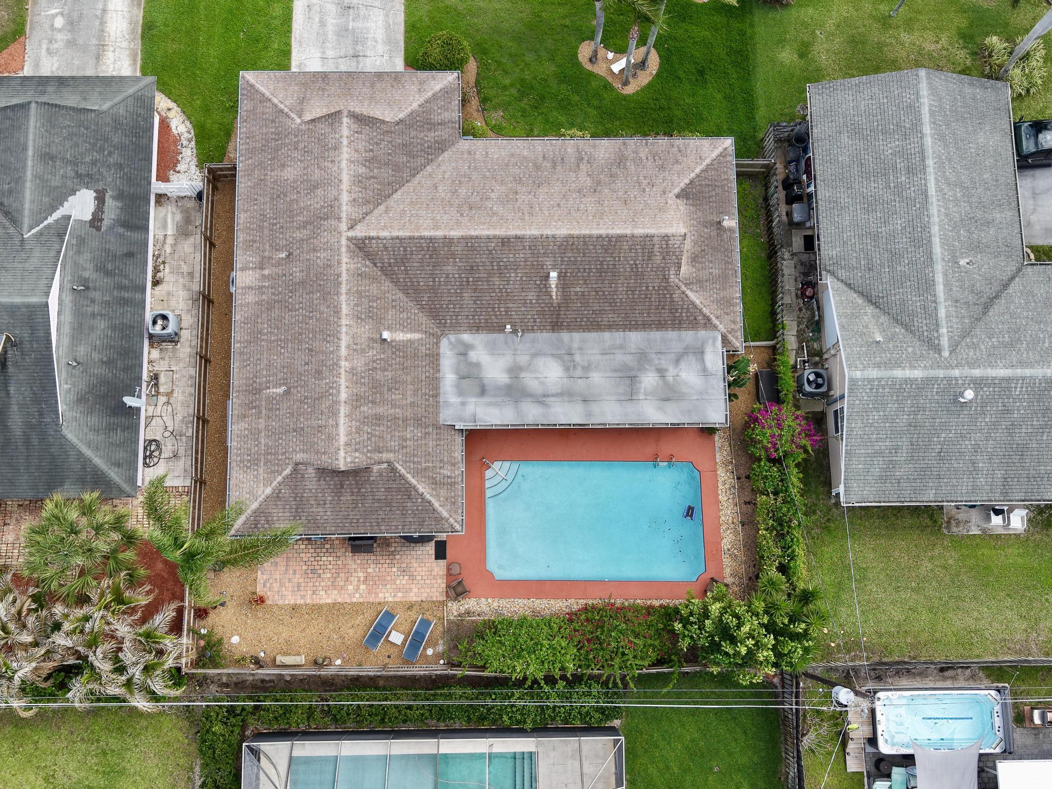 4167 Russell Street Jupiter, FL 33469 - Photo 51 of 60 an aerial view of a house with a garden and swimming pool