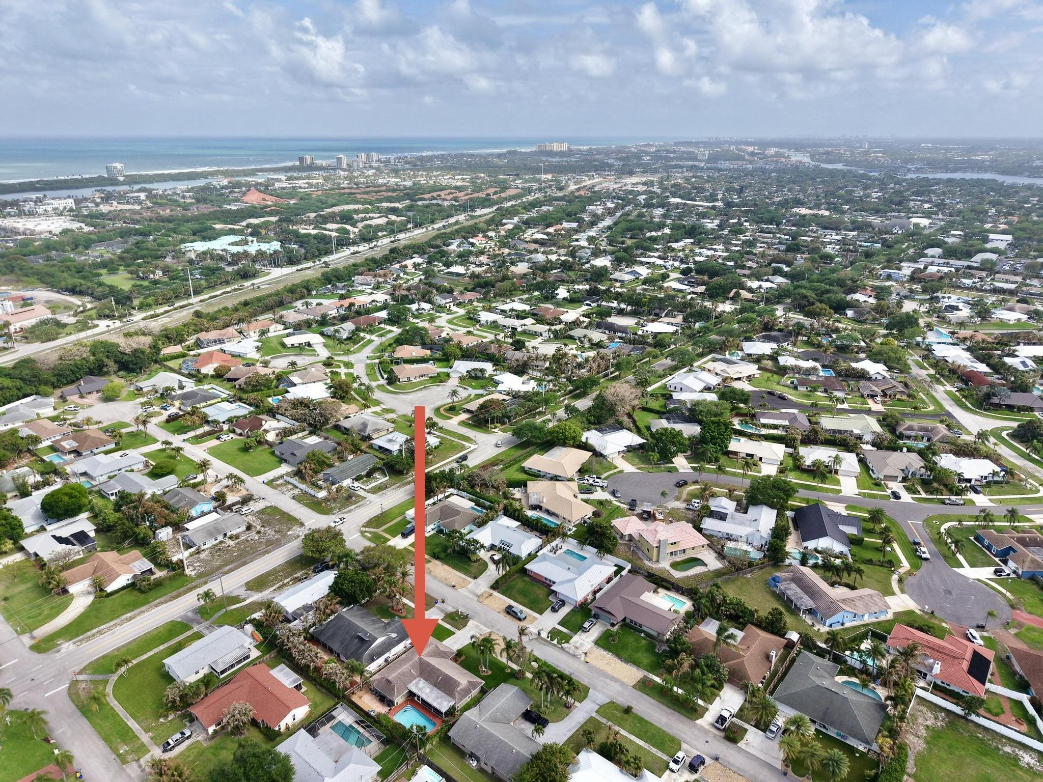 4167 Russell Street Jupiter, FL 33469 - Photo 58 of 60 an aerial view of residential houses with outdoor space and trees