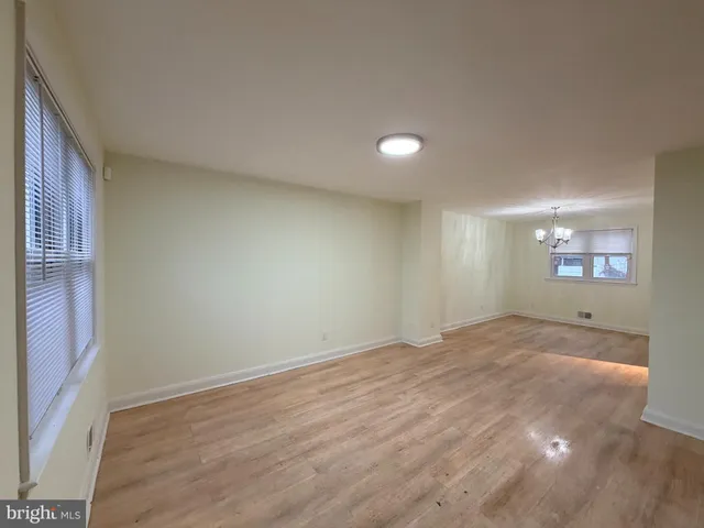 a view of an empty room and a window