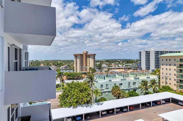 a view of building with swimming pool in front of it
