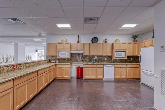 a living room with furniture and large window