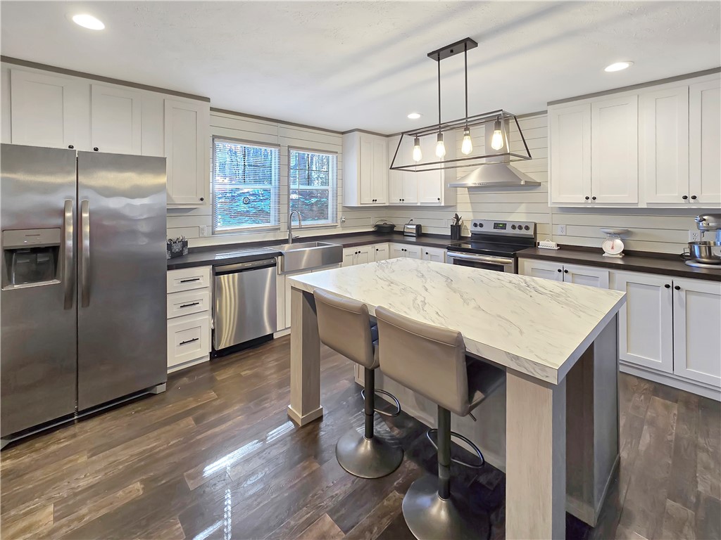 615 Generostee Church Road Starr, SC 29684 - Photo 4 of 20 This bright kitchen features a spacious island, perfect for culinary endeavors and casual dining.