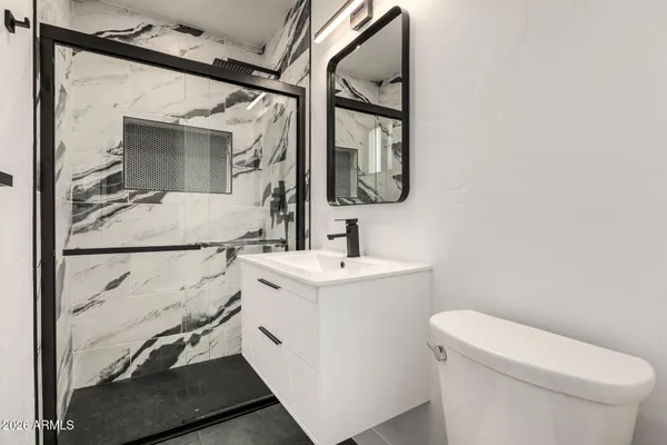 a bathroom with a sink and mirror