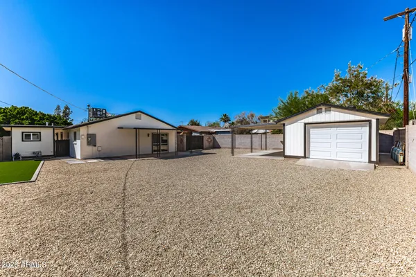 a view of a backyard with a patio
