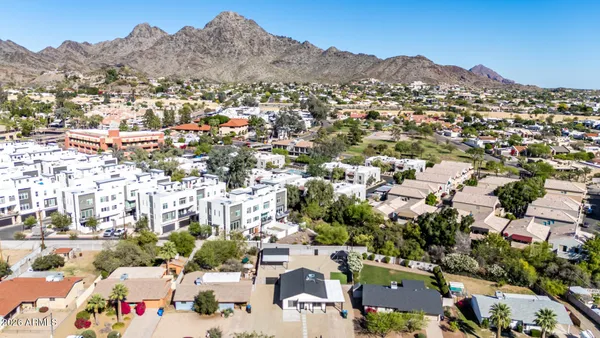 an aerial view of residential houses with outdoor space