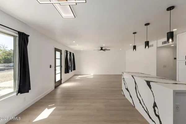 a bathroom with a sink a stove and mirror