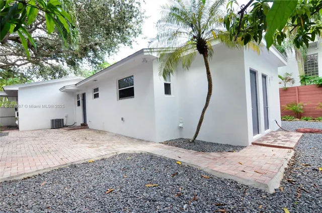 a backyard of a house with shower