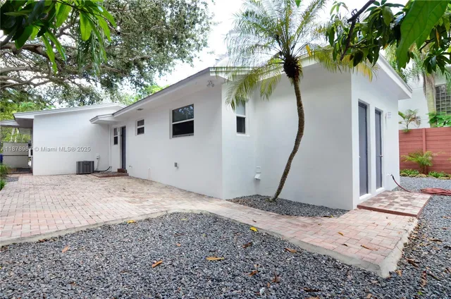 a house view with a backyard space