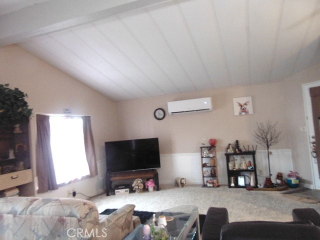 3835 Gardiner Ferry Road, Unit 36 Corning, CA 96021 - Photo 12 of 43 a bedroom with furniture and a flat screen tv