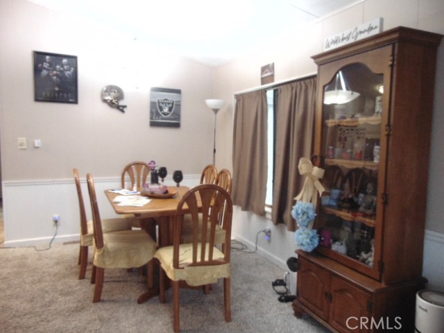 3835 Gardiner Ferry Road, Unit 36 Corning, CA 96021 - Photo 13 of 43 a dining room with furniture and window