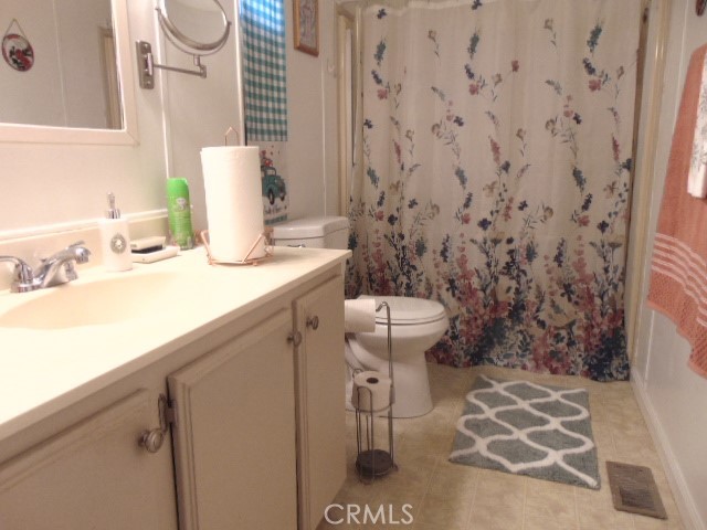 3835 Gardiner Ferry Road, Unit 36 Corning, CA 96021 - Photo 20 of 43 a bathroom with a sink toilet and shower