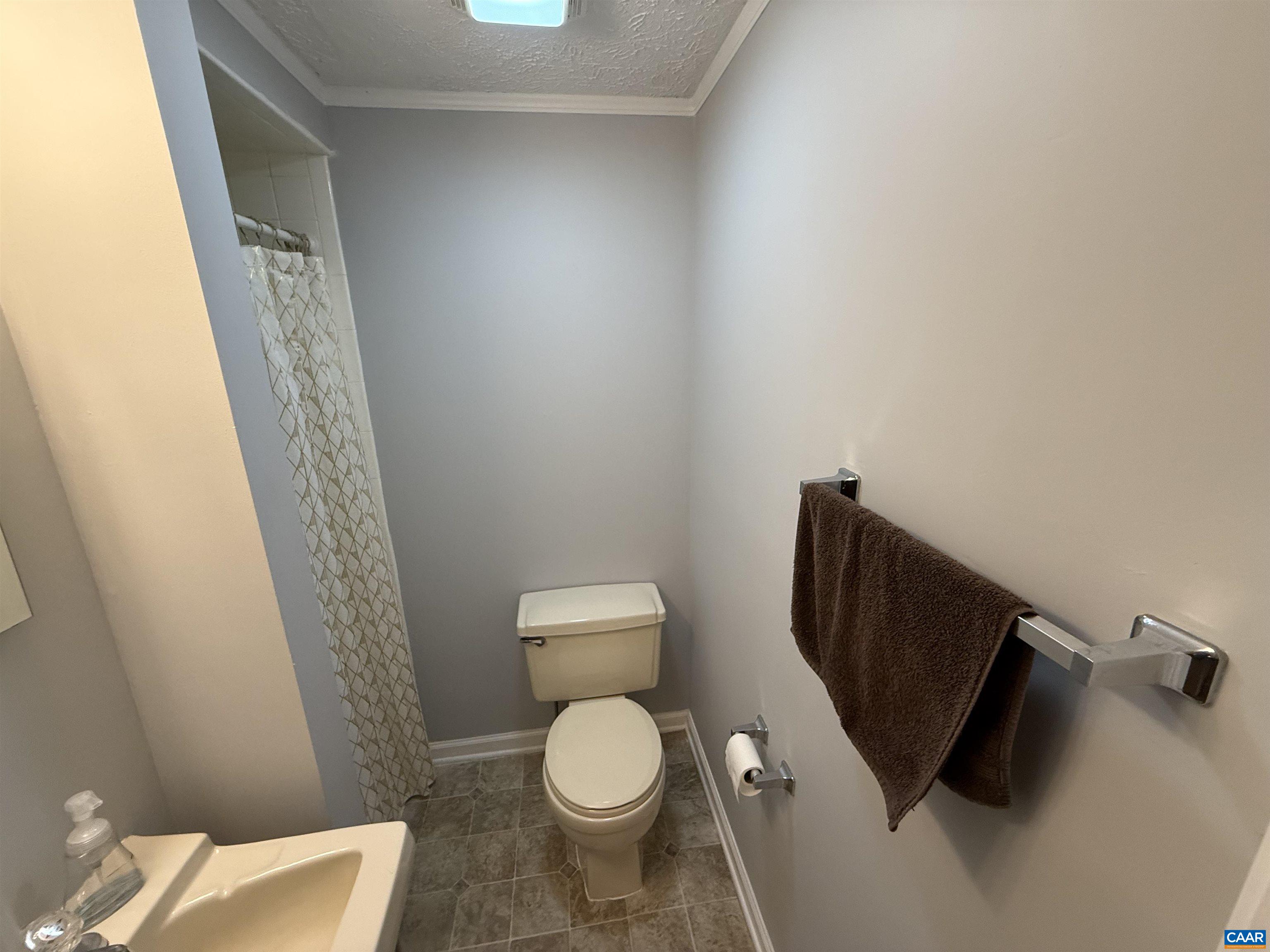 2002 Oliver Creek Road Troy, VA 22974 - Photo 22 of 38 a white toilet sitting next to a shower