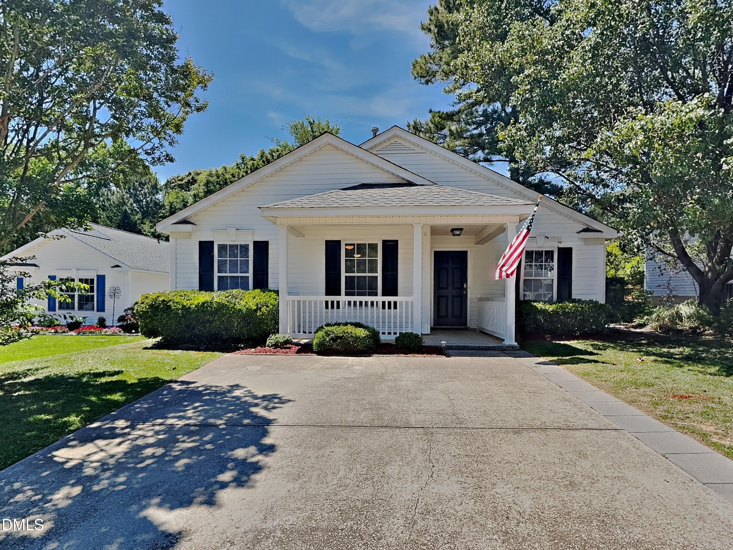 5516 Wilhagan Court Raleigh, NC 27616 - Photo 1 of 16 a front view of a house with a yard and porch