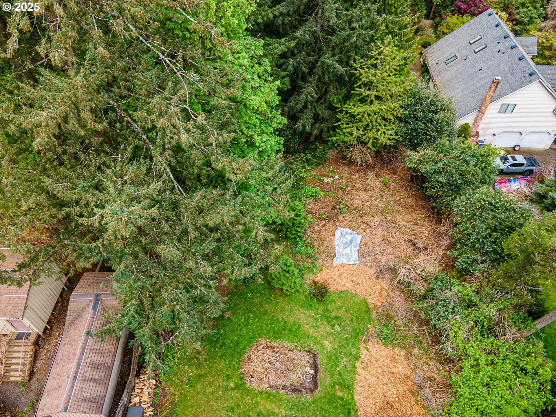 0 Southwest 25th Avenue, Unit 2 Portland, OR 97219 - Photo 4 of 12 a aerial view of a house with a yard and garden