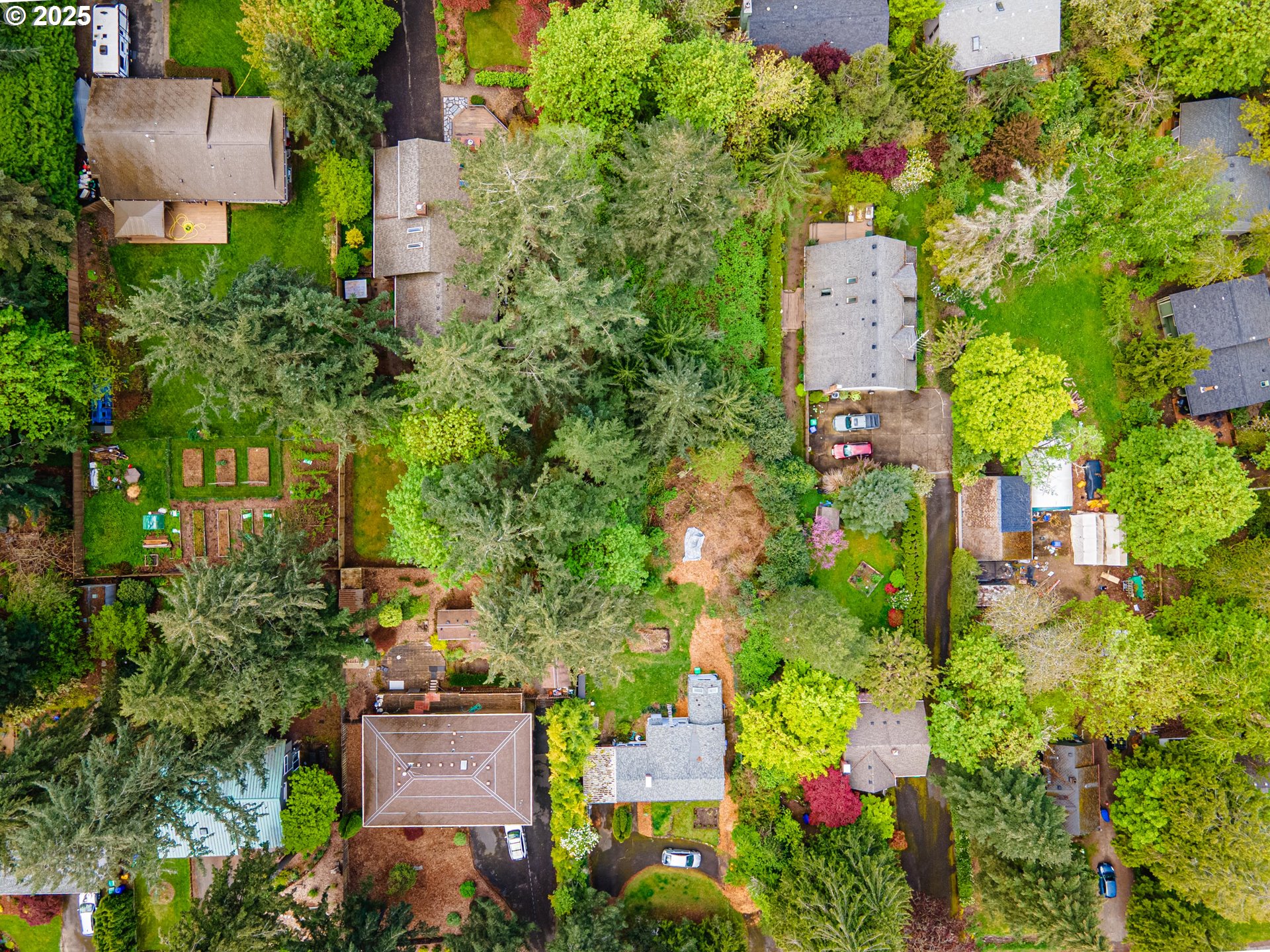 0 Southwest 25th Avenue, Unit 2 Portland, OR 97219 - Photo 9 of 12 an aerial view of a house with a yard and garden
