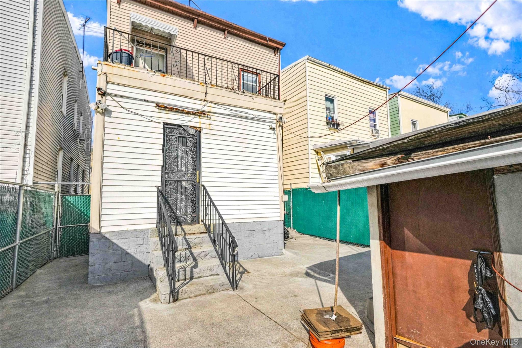 96-12 34th Avenue Queens, NY 11368 - Photo 30 of 35 a front view of a house