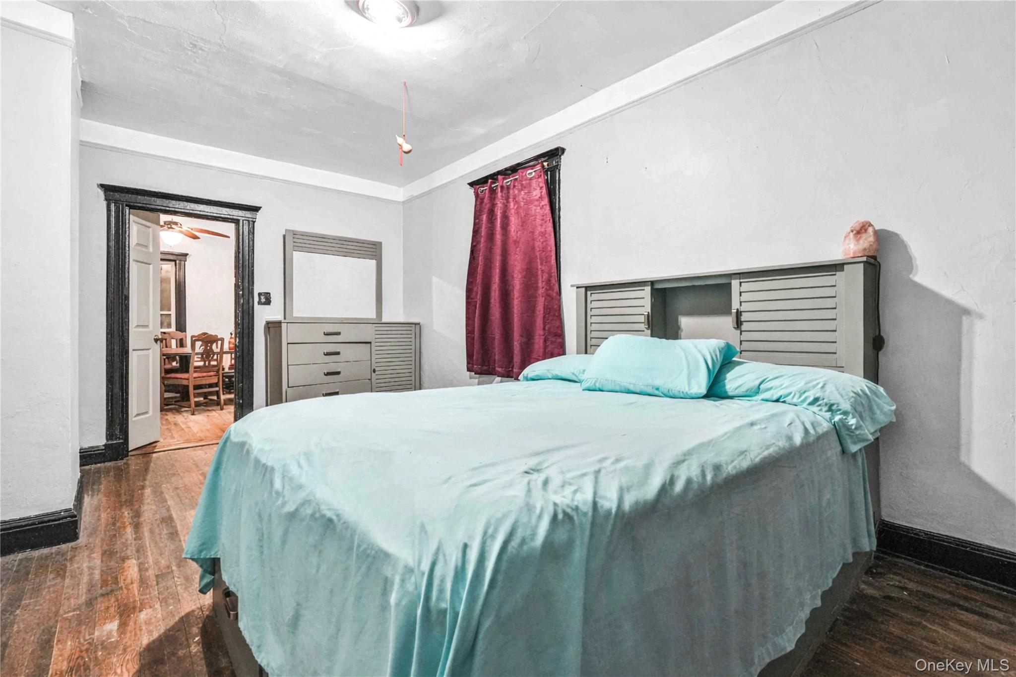 96-12 34th Avenue Queens, NY 11368 - Photo 5 of 35 a bedroom with a bed and a closet