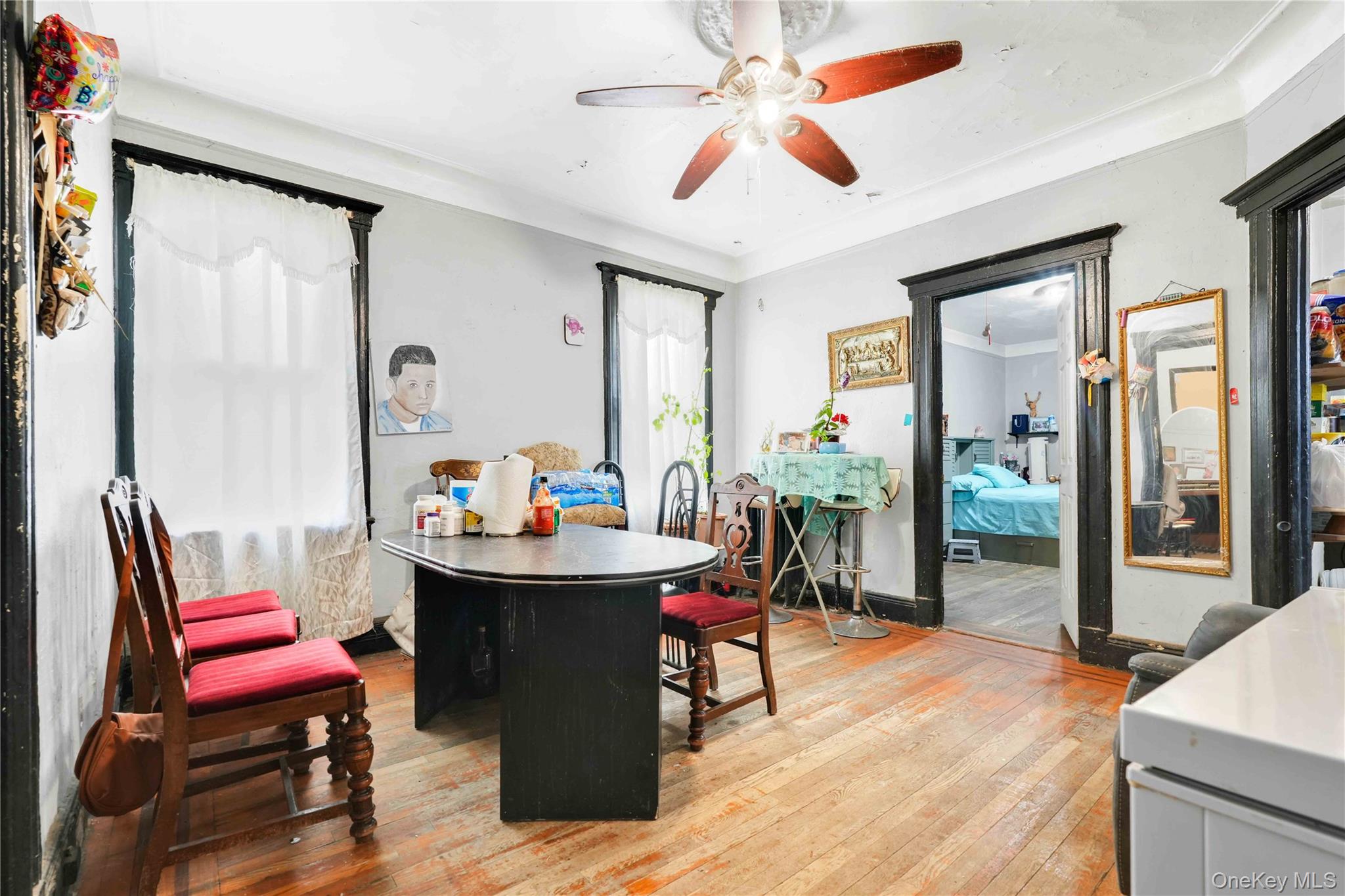 96-12 34th Avenue Queens, NY 11368 - Photo 10 of 35 a dining room with a table and chairs