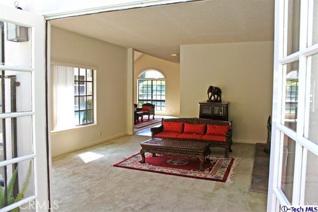 849 Moorside Drive Glendale, CA 91207 - Photo 10 of 19 a living room with furniture a rug and a large window