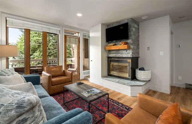 a living room with furniture and a flat screen tv