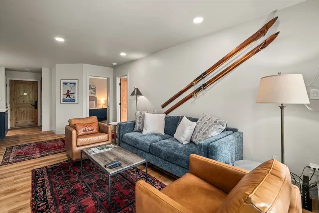 a living room with furniture and a lamp