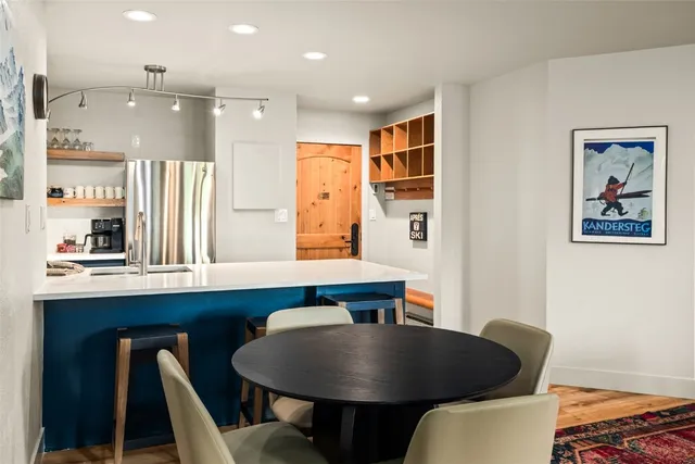 a dining room with furniture and window