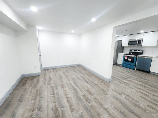 a view of kitchen with wooden floor