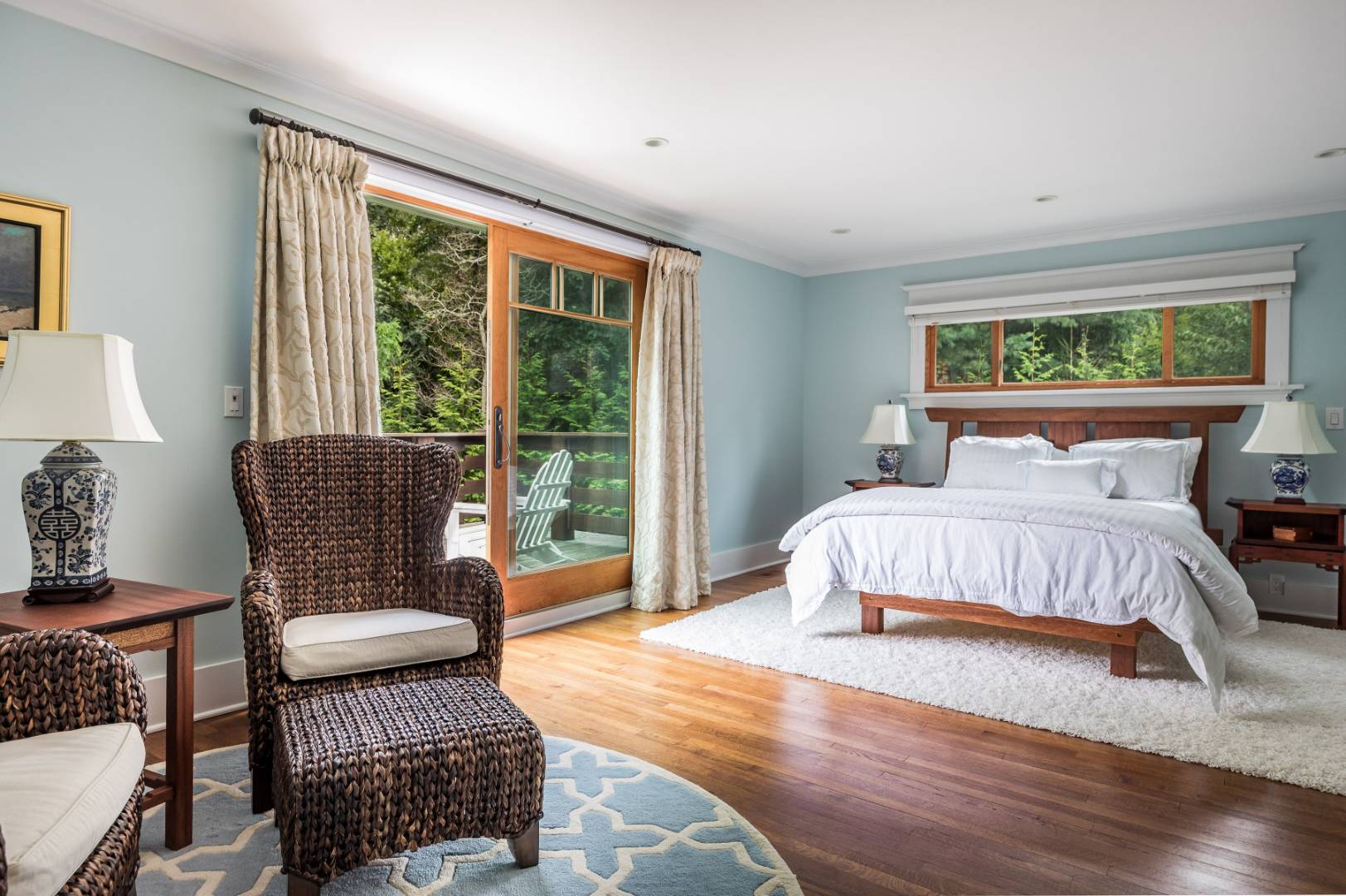 30 East Hollow Road East Hampton, NY 11937 - Photo 15 of 29 a bedroom with a bed chairs and window