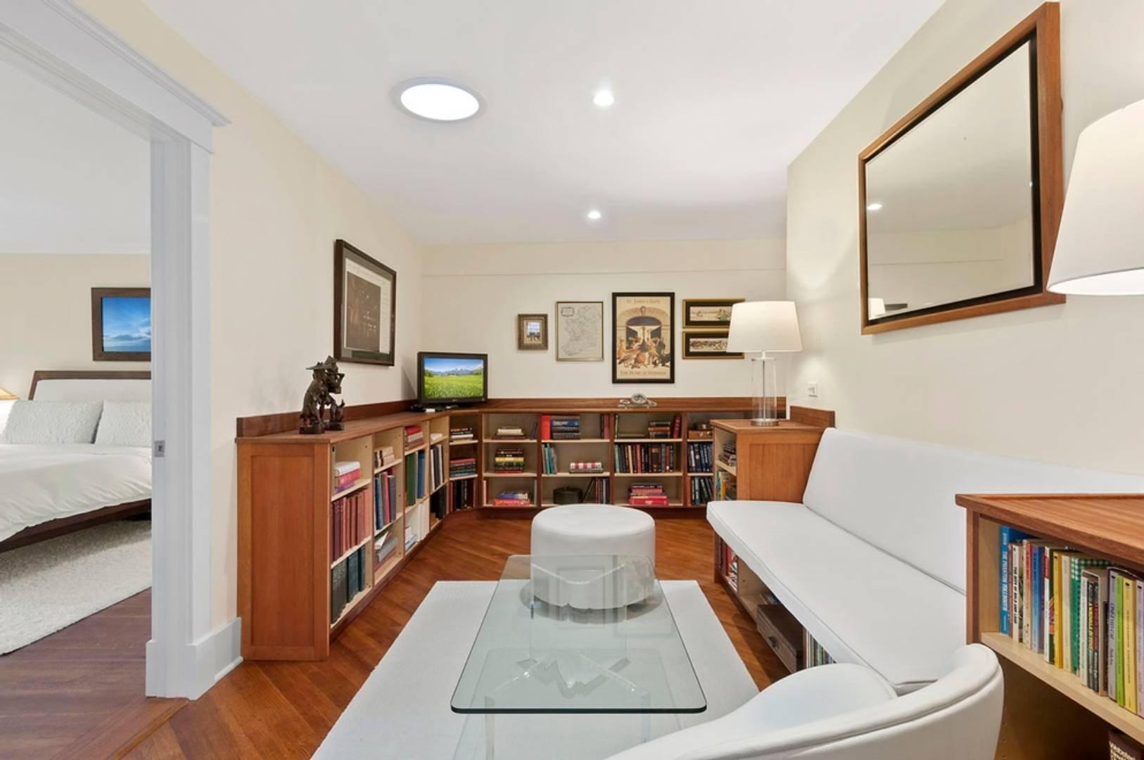 30 East Hollow Road East Hampton, NY 11937 - Photo 19 of 29 a living room with furniture and a flat screen tv