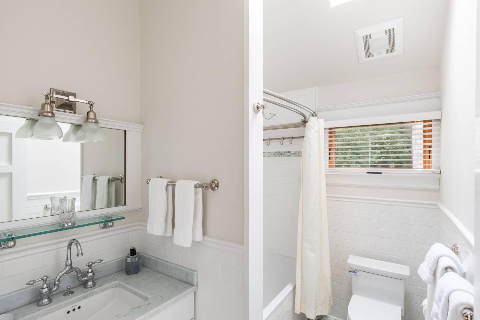 30 East Hollow Road East Hampton, NY 11937 - Photo 21 of 29 a bathroom with a granite countertop sink and a mirror