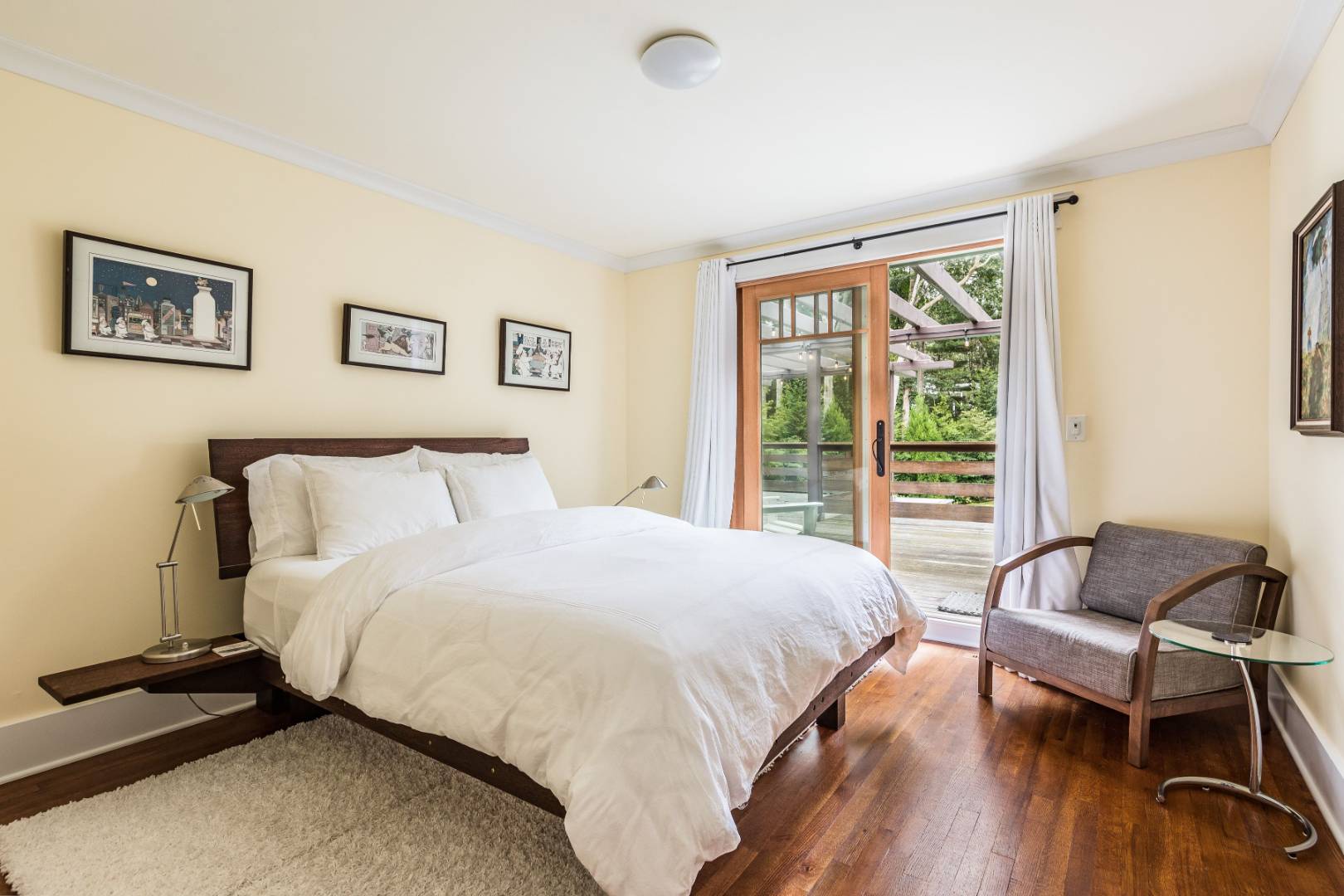 30 East Hollow Road East Hampton, NY 11937 - Photo 22 of 29 a bedroom with a bed and a desk
