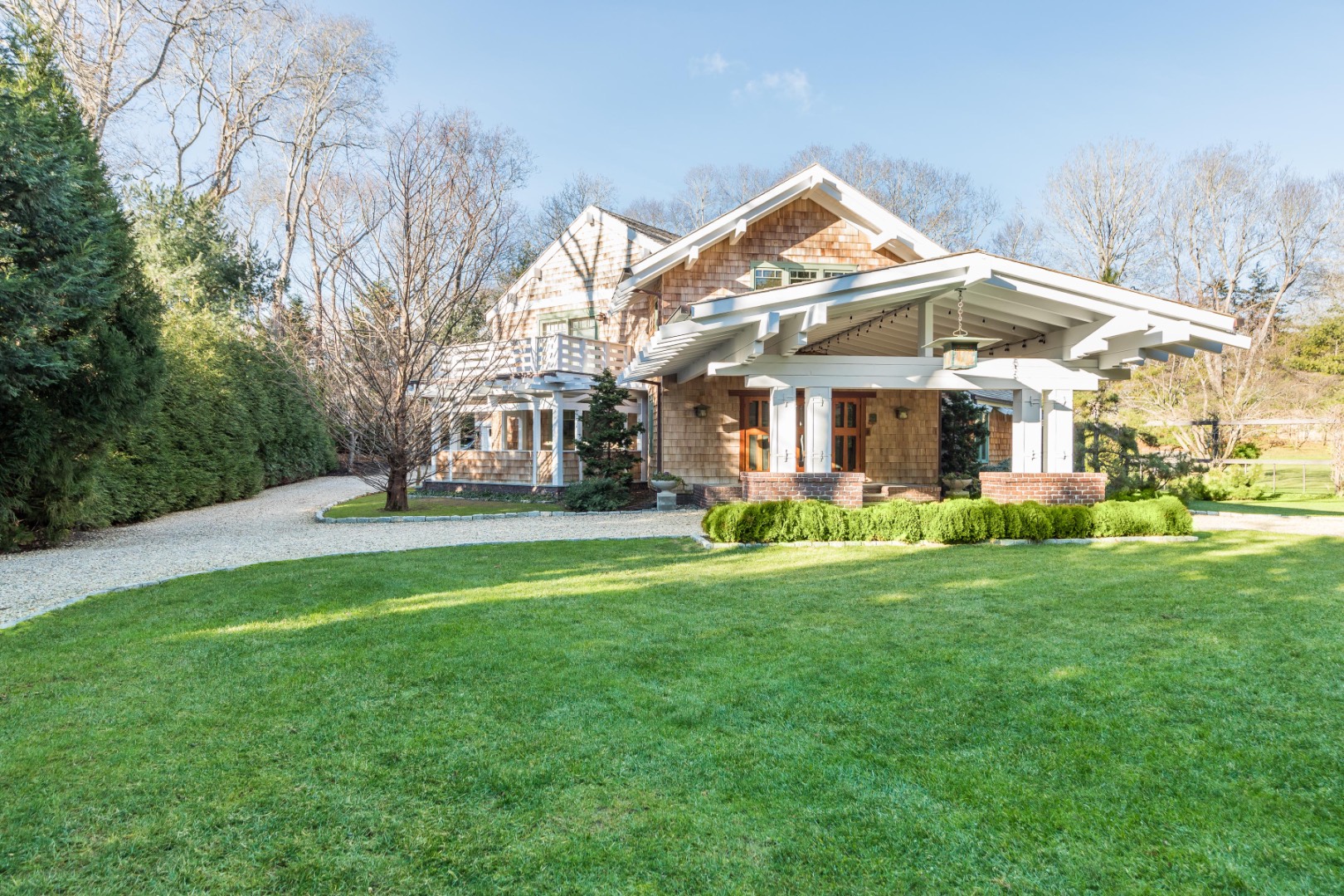 30 East Hollow Road East Hampton, NY 11937 - Photo 26 of 29 a view of a house with a big yard and large trees